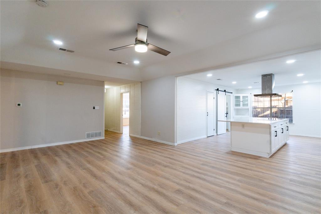 313 South Prairie Street Pilot Point, TX 76258 - Photo 5 of 16 a view of kitchen with wooden floor and electronic appliances