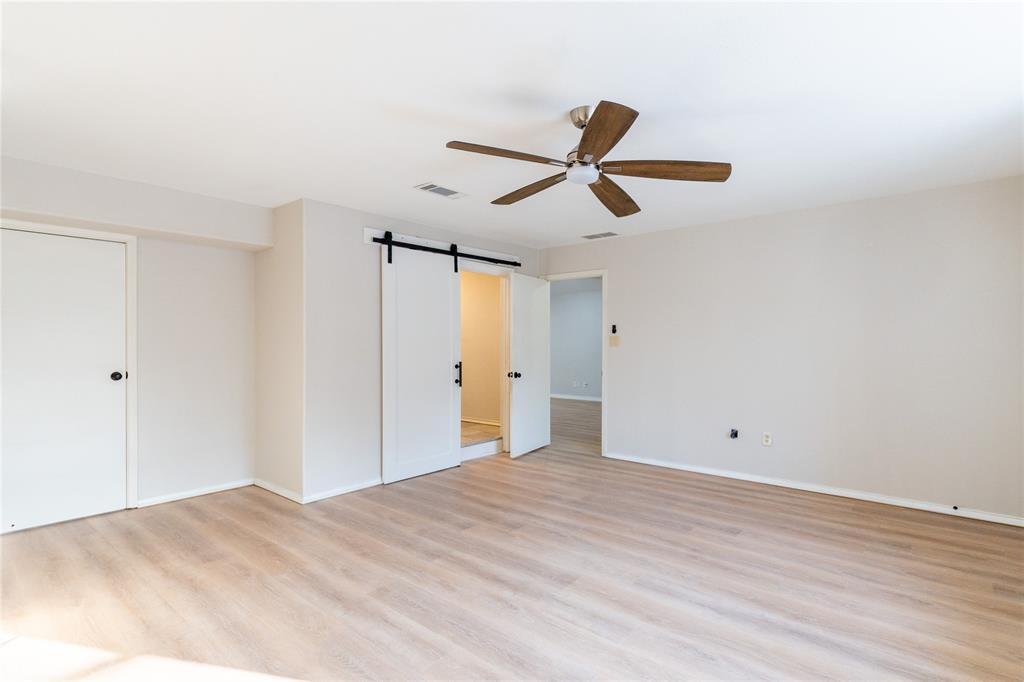 313 South Prairie Street Pilot Point, TX 76258 - Photo 8 of 16 a view of empty room with wooden floor