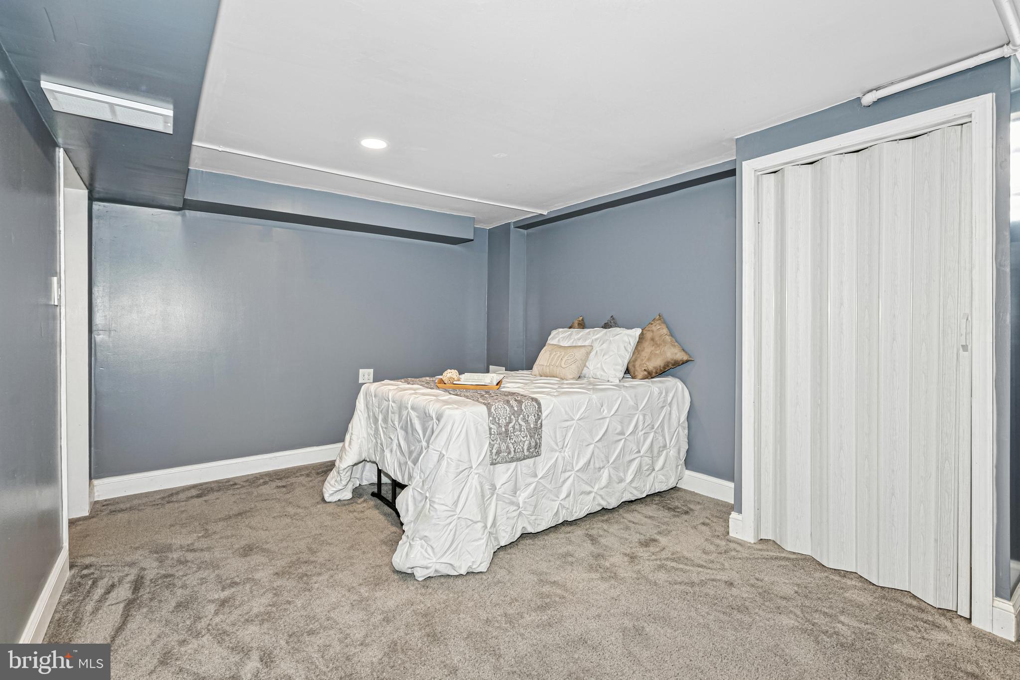 8272 Kavanagh Road Baltimore, MD 21222 - Photo 13 of 32 a bedroom with a bed and a window