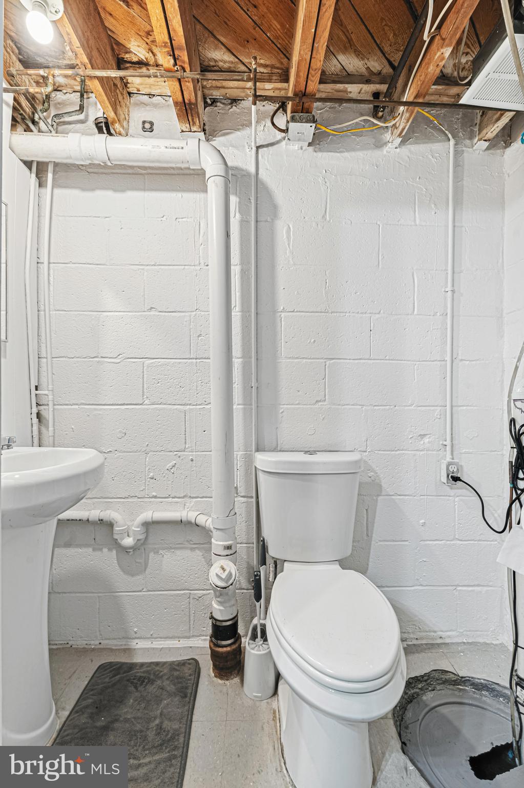 8272 Kavanagh Road Baltimore, MD 21222 - Photo 16 of 32 a bathroom with a toilet and a shower