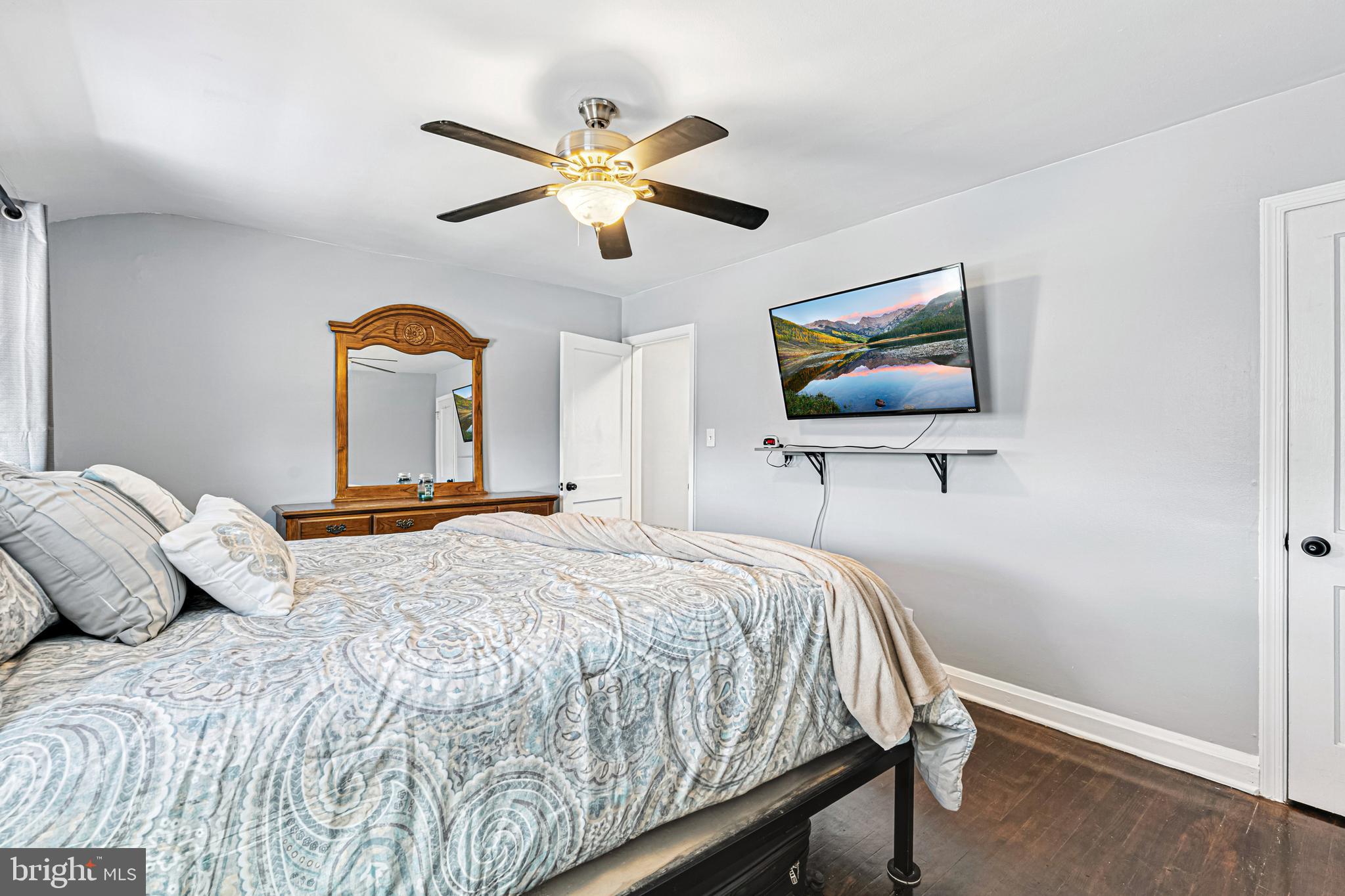 8272 Kavanagh Road Baltimore, MD 21222 - Photo 19 of 32 a bedroom with a bed and a flat screen tv