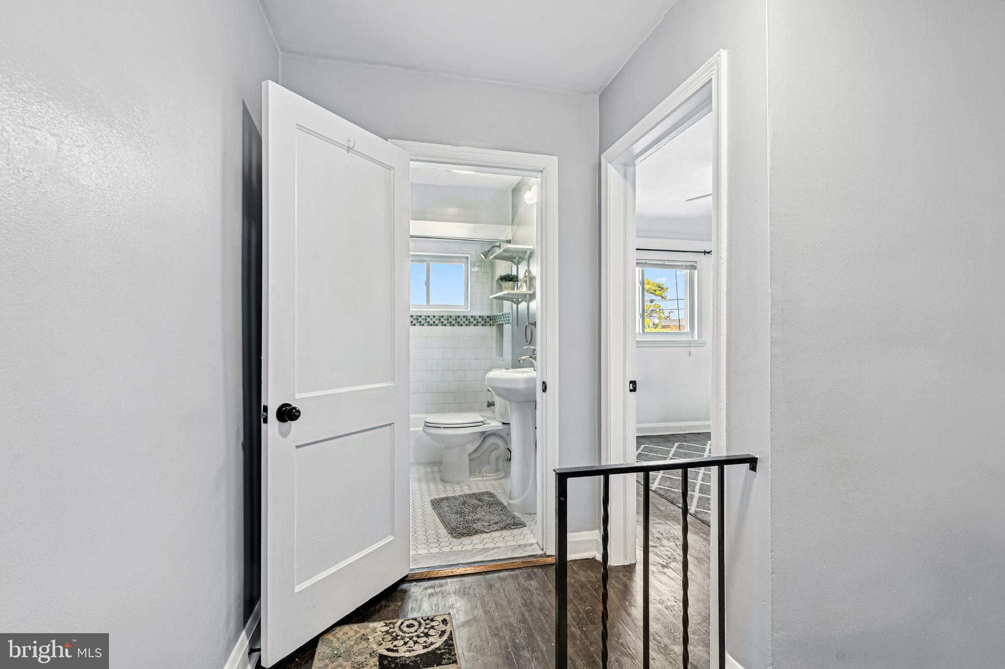 8272 Kavanagh Road Baltimore, MD 21222 - Photo 20 of 32 a view of a hallway with a livingroom and fireplace