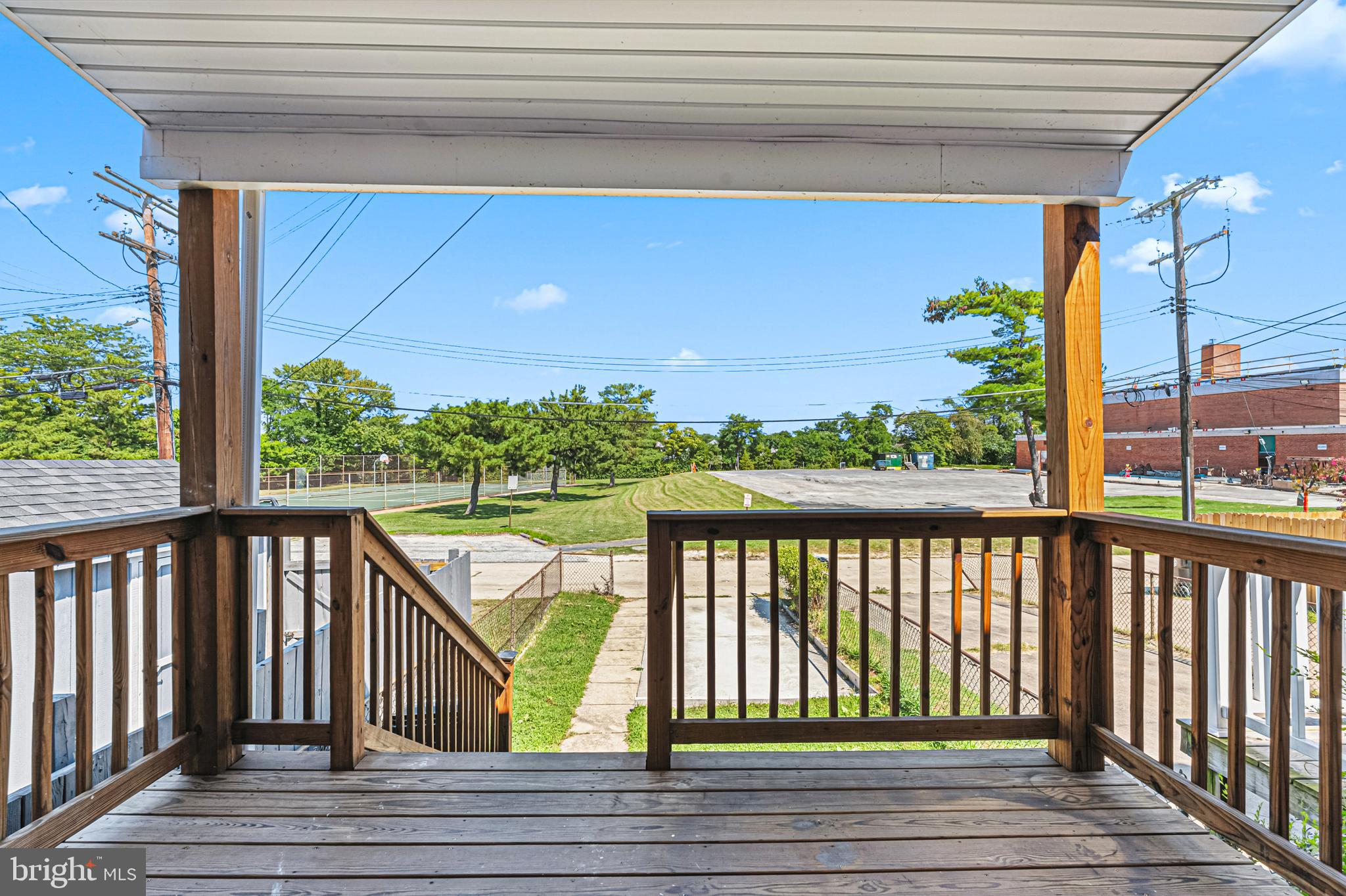 8272 Kavanagh Road Baltimore, MD 21222 - Photo 25 of 32 a view of balcony with wooden floor and fence