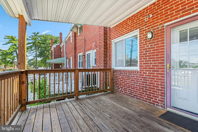 a view of a brick house with wooden floor