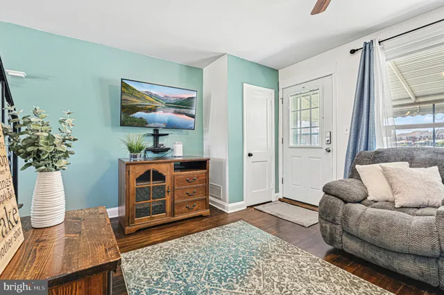 a living room with furniture rug and window