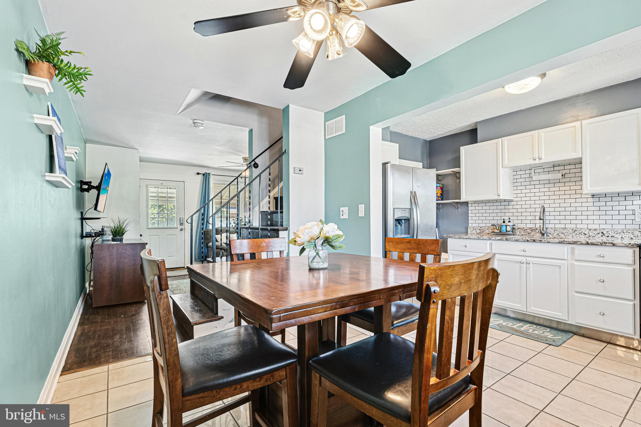8272 Kavanagh Road Baltimore, MD 21222 - Photo 7 of 32 a dining room with furniture a rug and wooden floor