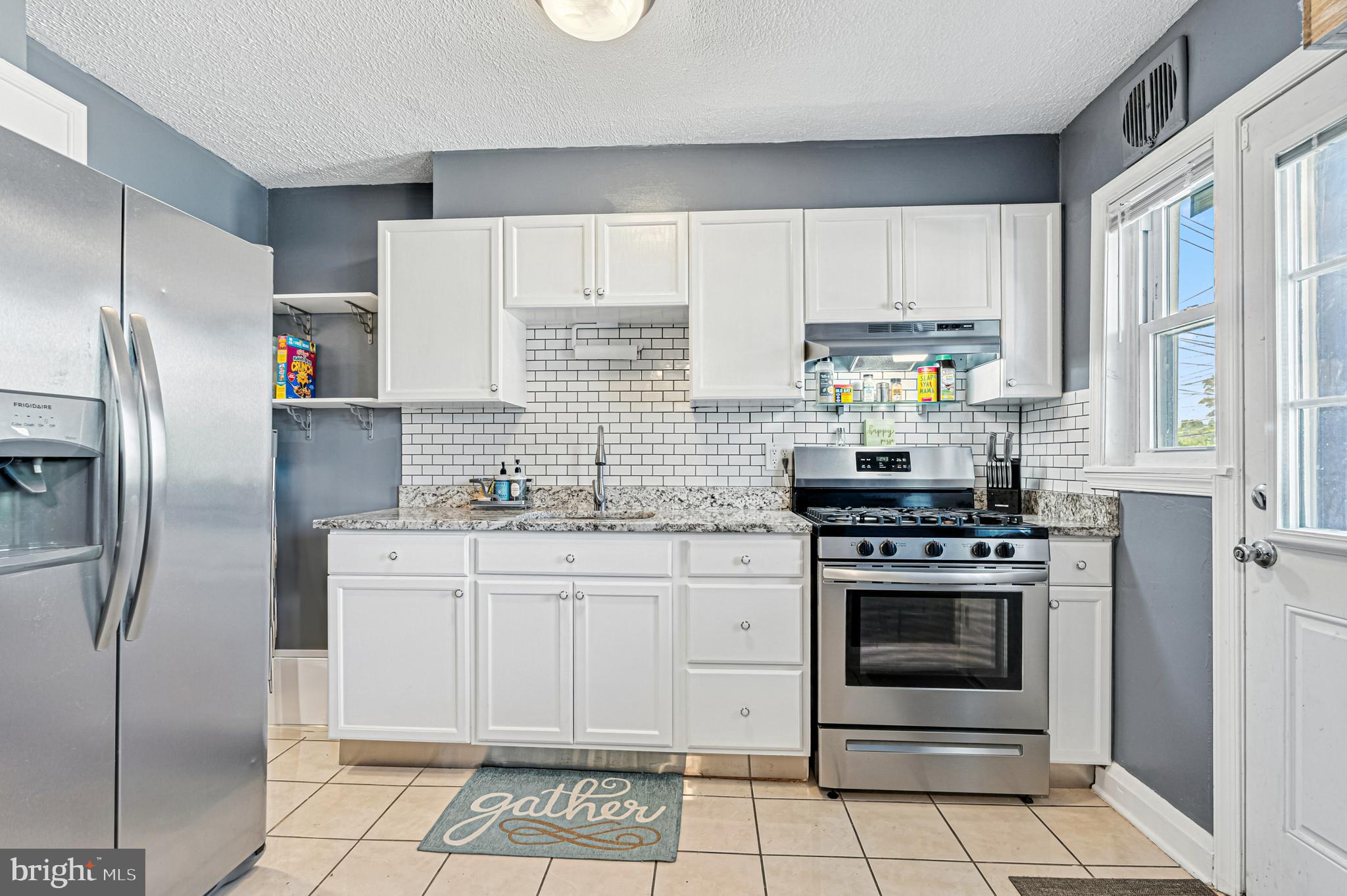8272 Kavanagh Road Baltimore, MD 21222 - Photo 8 of 32 a kitchen with stainless steel appliances granite countertop a stove a refrigerator and a sink