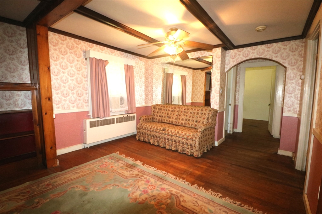 27 Henry Street Sharon, MA 02067 - Photo 9 of 19 a spacious bedroom with a bed a mirror and a large window