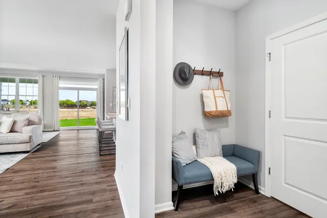 a view of bedroom with a bed and wooden floor