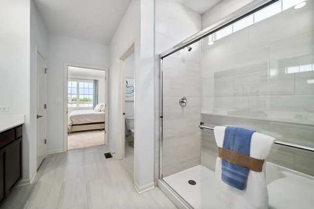 a bathroom with a shower and toilet