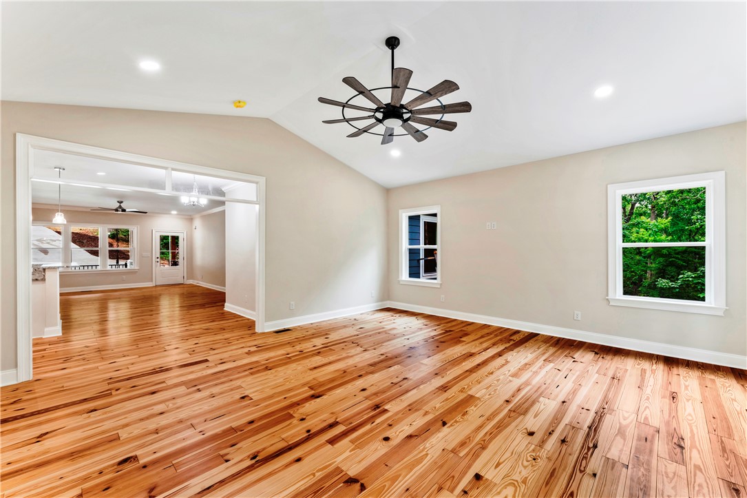 110 Gabriel Way Pickens, SC 29671 - Photo 15 of 48 Natural light dances across wide plank wood floors in this inviting living space.
