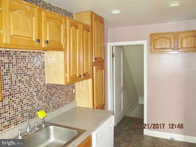 4416 Eldone Road Baltimore, MD 21229 - Photo 8 of 21 a bathroom with a sink and a shower