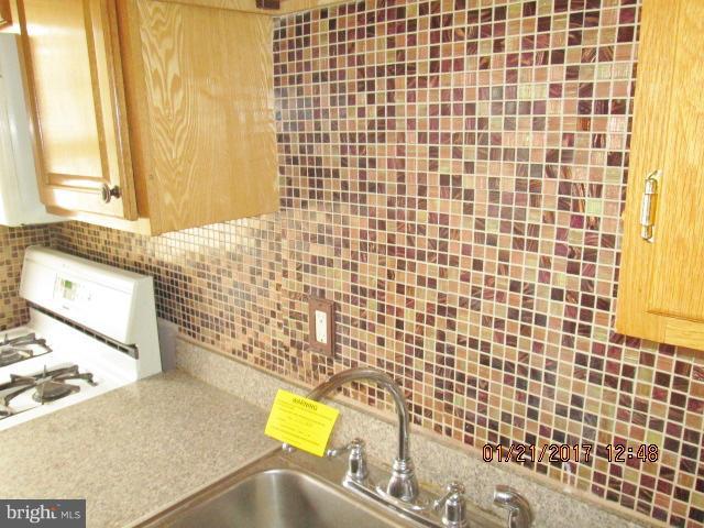 4416 Eldone Road Baltimore, MD 21229 - Photo 9 of 21 a bathroom with a sink toilet and shower