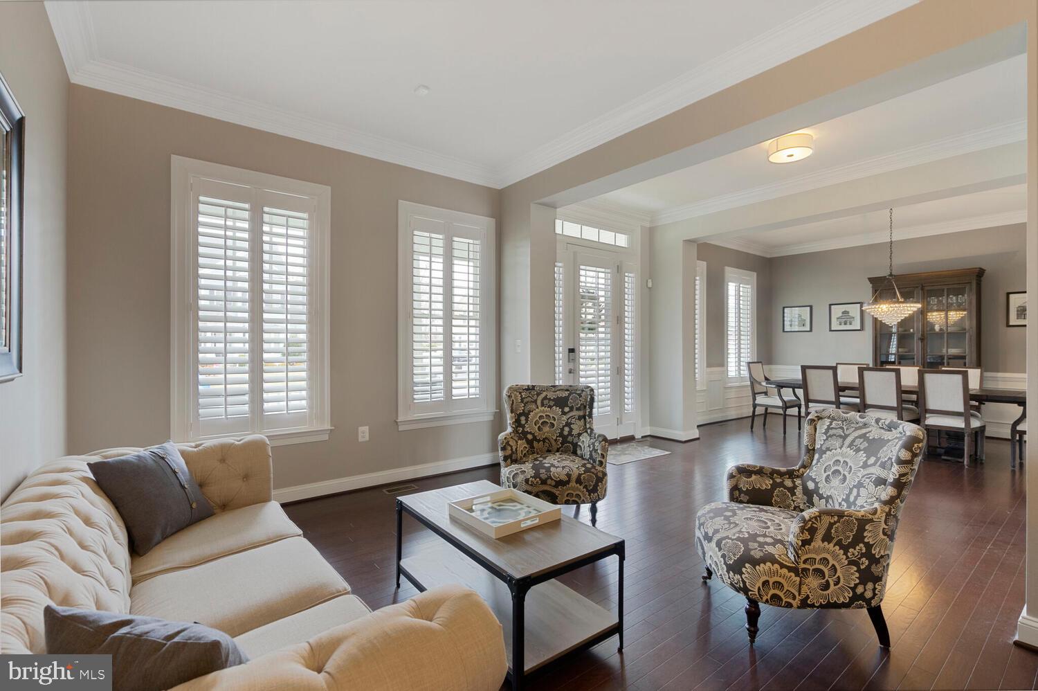 41729 Bloomfield Path Street Ashburn, VA 20148 - Photo 13 of 65 a living room with furniture and a large window
