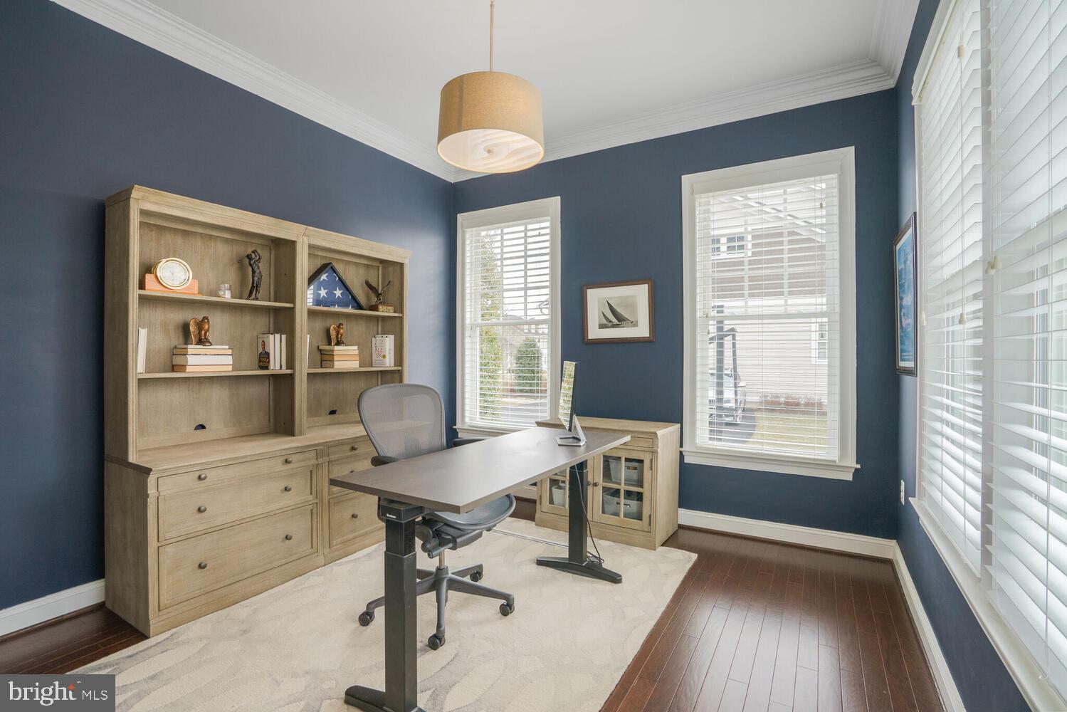 41729 Bloomfield Path Street Ashburn, VA 20148 - Photo 30 of 65 a view of a workspace with furniture and a window