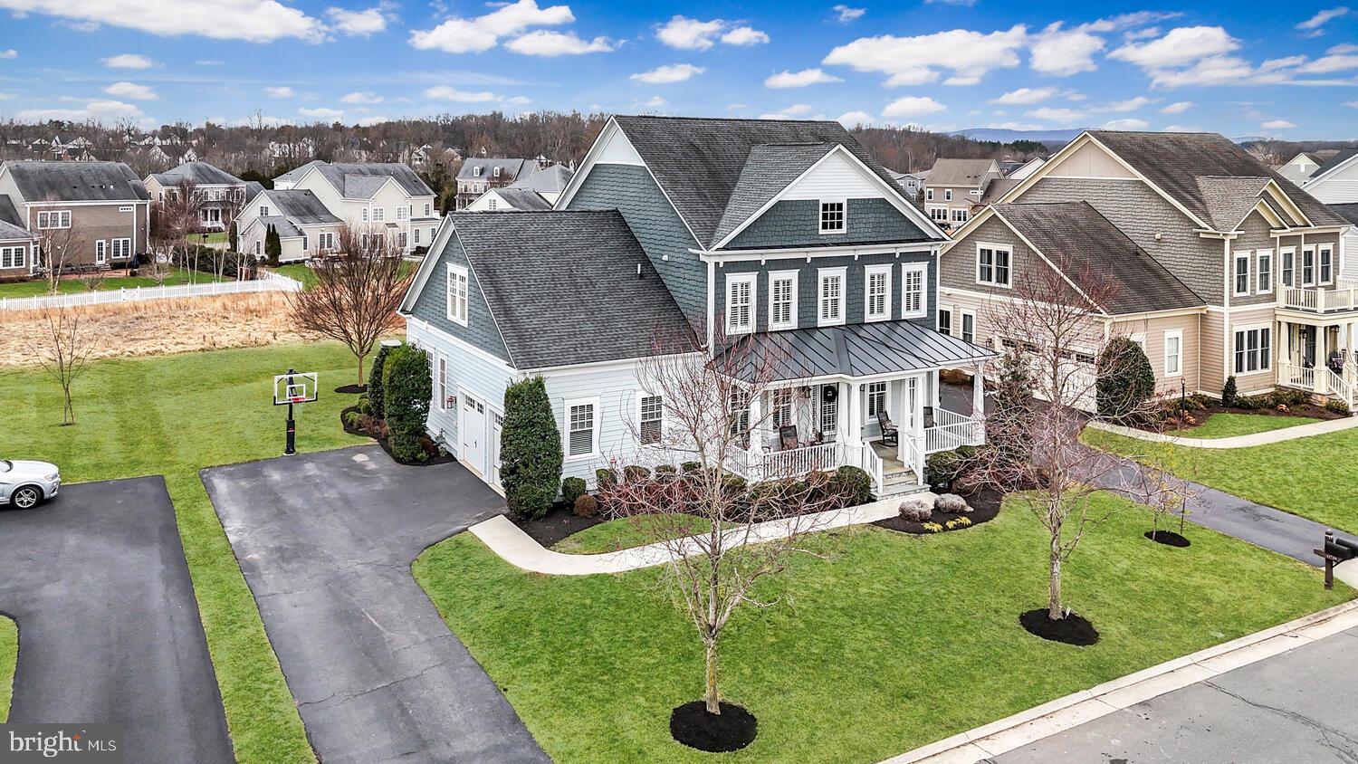 41729 Bloomfield Path Street Ashburn, VA 20148 - Photo 3 of 65 a front view of a house with garden