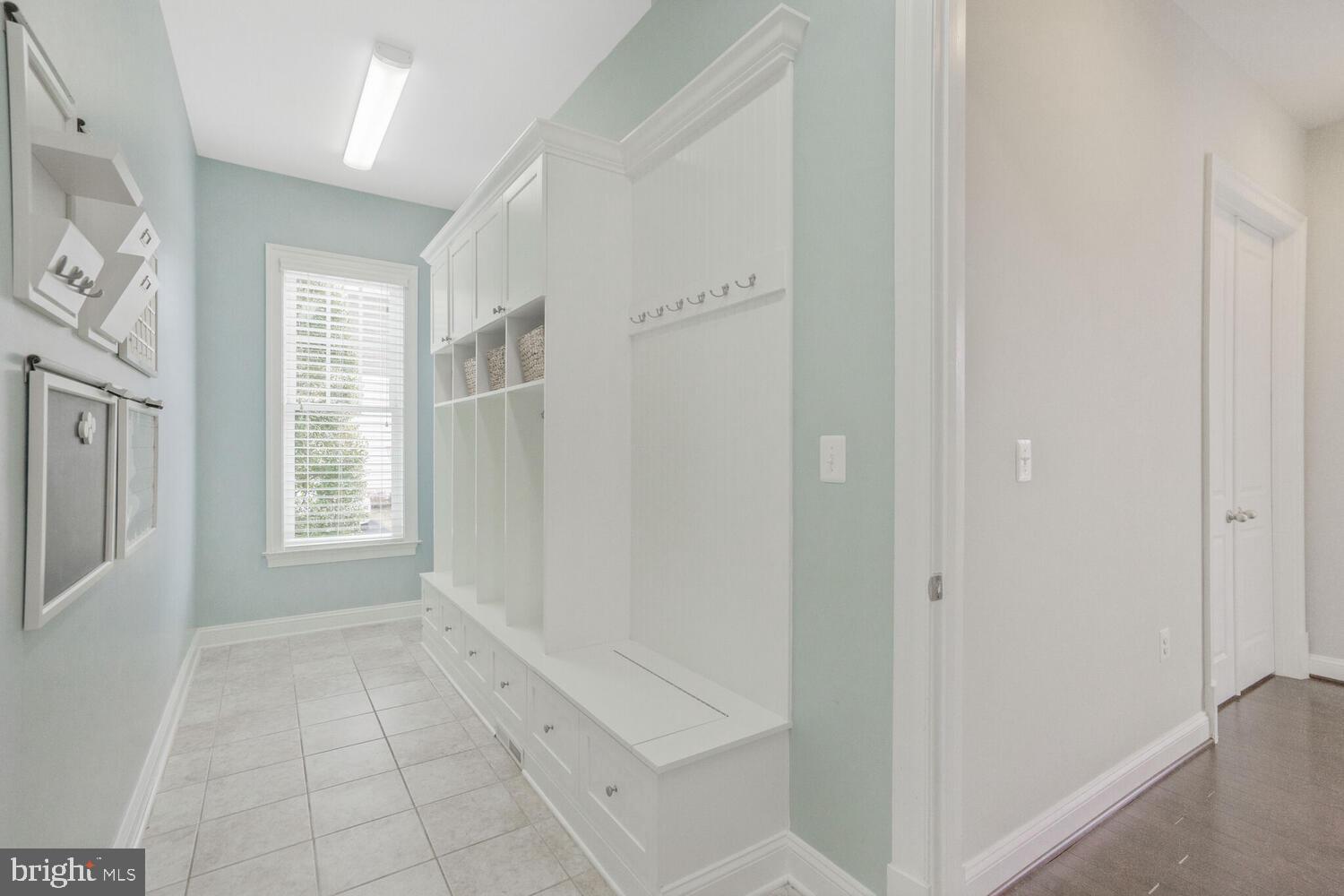 41729 Bloomfield Path Street Ashburn, VA 20148 - Photo 32 of 65 a view of an empty room with windows