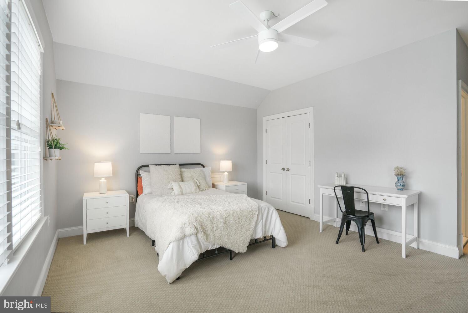 41729 Bloomfield Path Street Ashburn, VA 20148 - Photo 45 of 65 a bedroom with a bed and a table in it