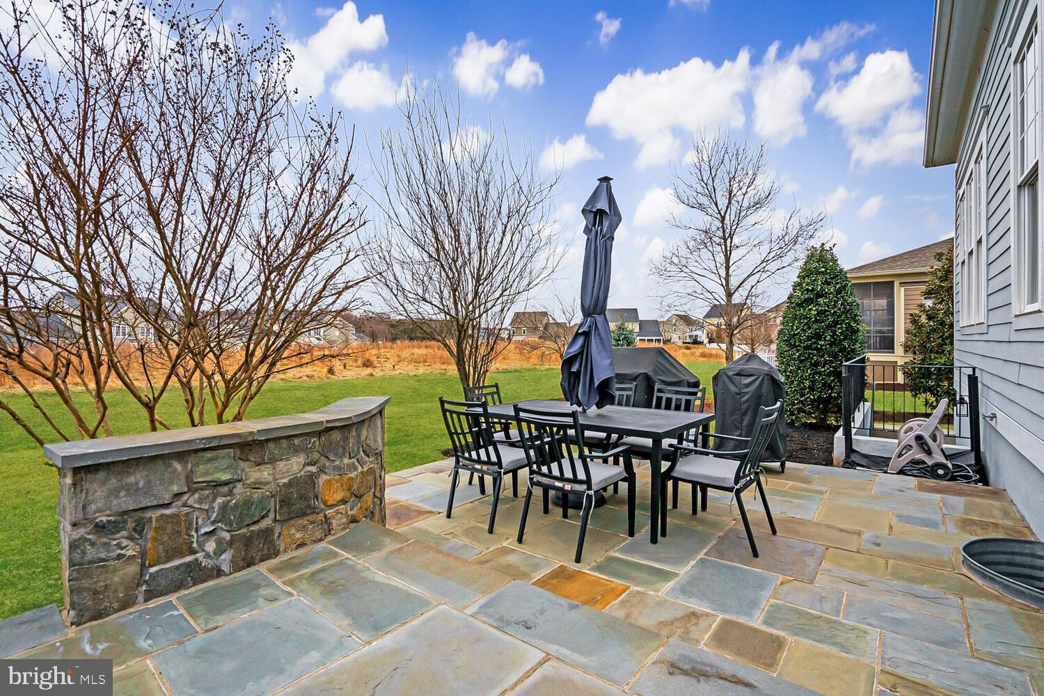 41729 Bloomfield Path Street Ashburn, VA 20148 - Photo 63 of 65 a view of a tables and chairs in patio