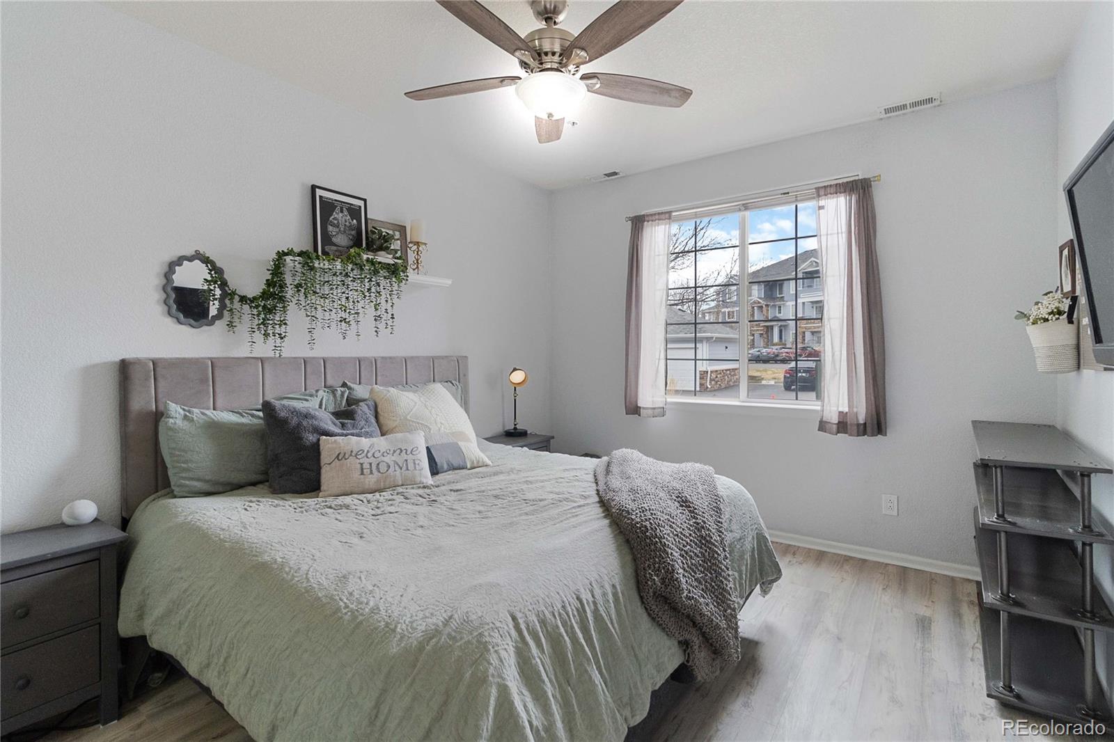 5255 Memphis Street, Unit 702 Denver, CO 80239 - Photo 15 of 30 a bedroom with a bed and a window