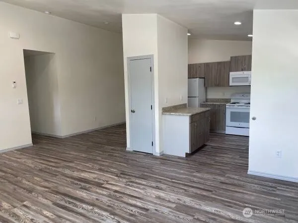 a kitchen with stainless steel appliances granite countertop a stove and a refrigerator
