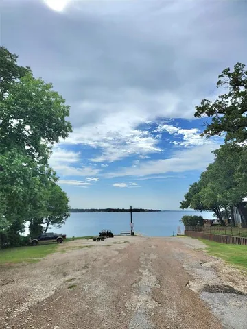 a view of a lake with houses in the back