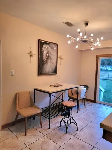 a view of a livingroom with furniture and a chandelier