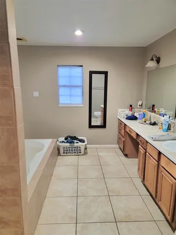 a kitchen with a cabinets and window