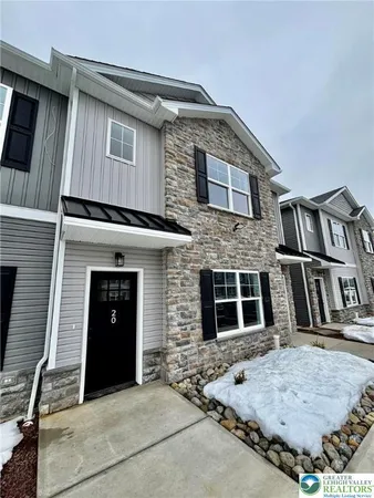 a front view of a house with garage