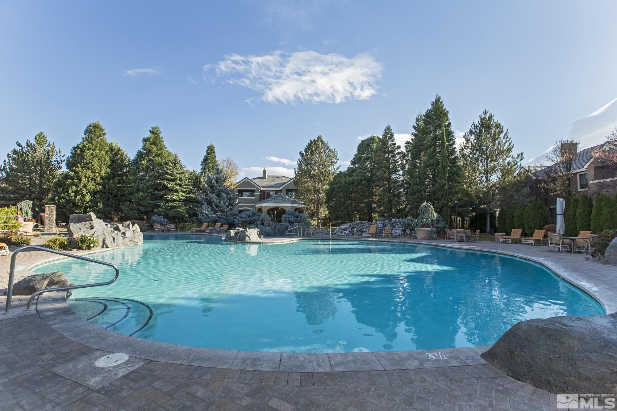 900 South Meadows Parkway, Unit 111 Reno, NV 89521 - Photo 33 of 35 a view of a swimming pool with a yard