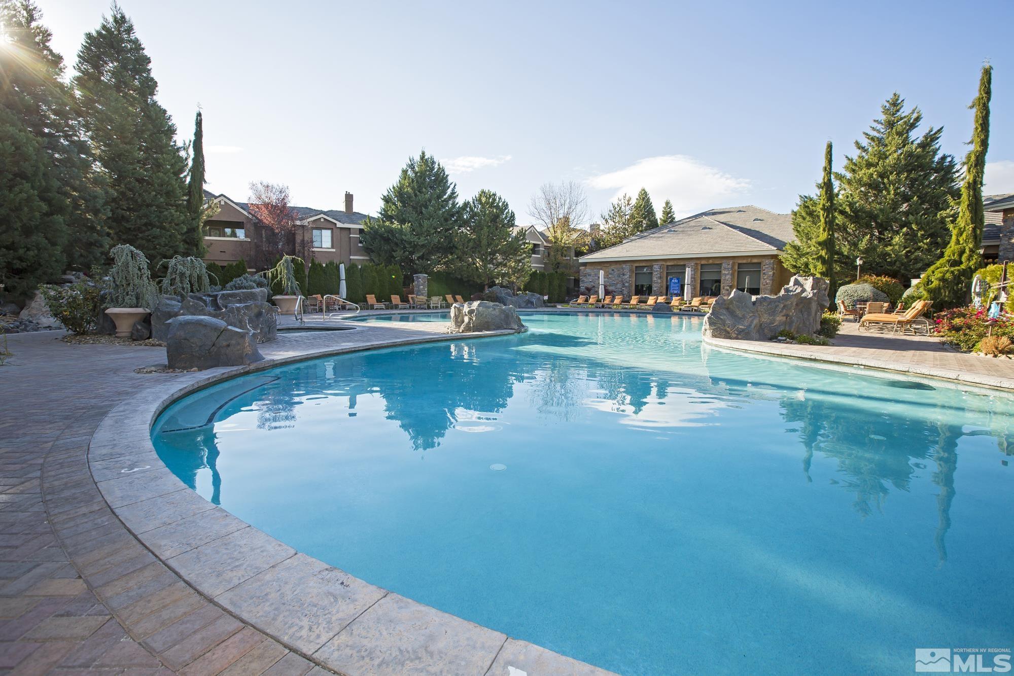 900 South Meadows Parkway, Unit 111 Reno, NV 89521 - Photo 34 of 35 a view of a swimming pool with lounge chair