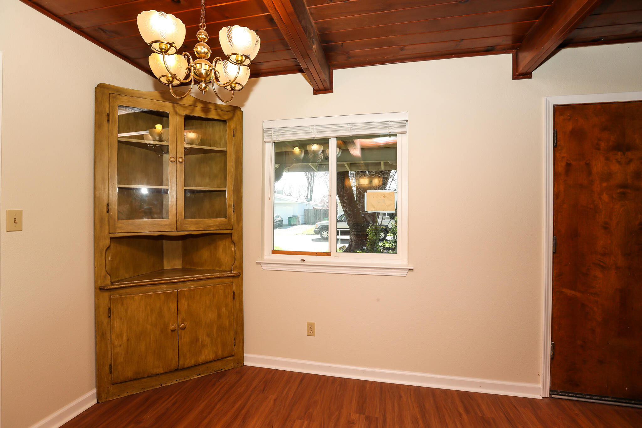 2867 Pinto Lane Anderson, CA 96007 - Photo 19 of 35 a view of a room with wooden floor and chandelier