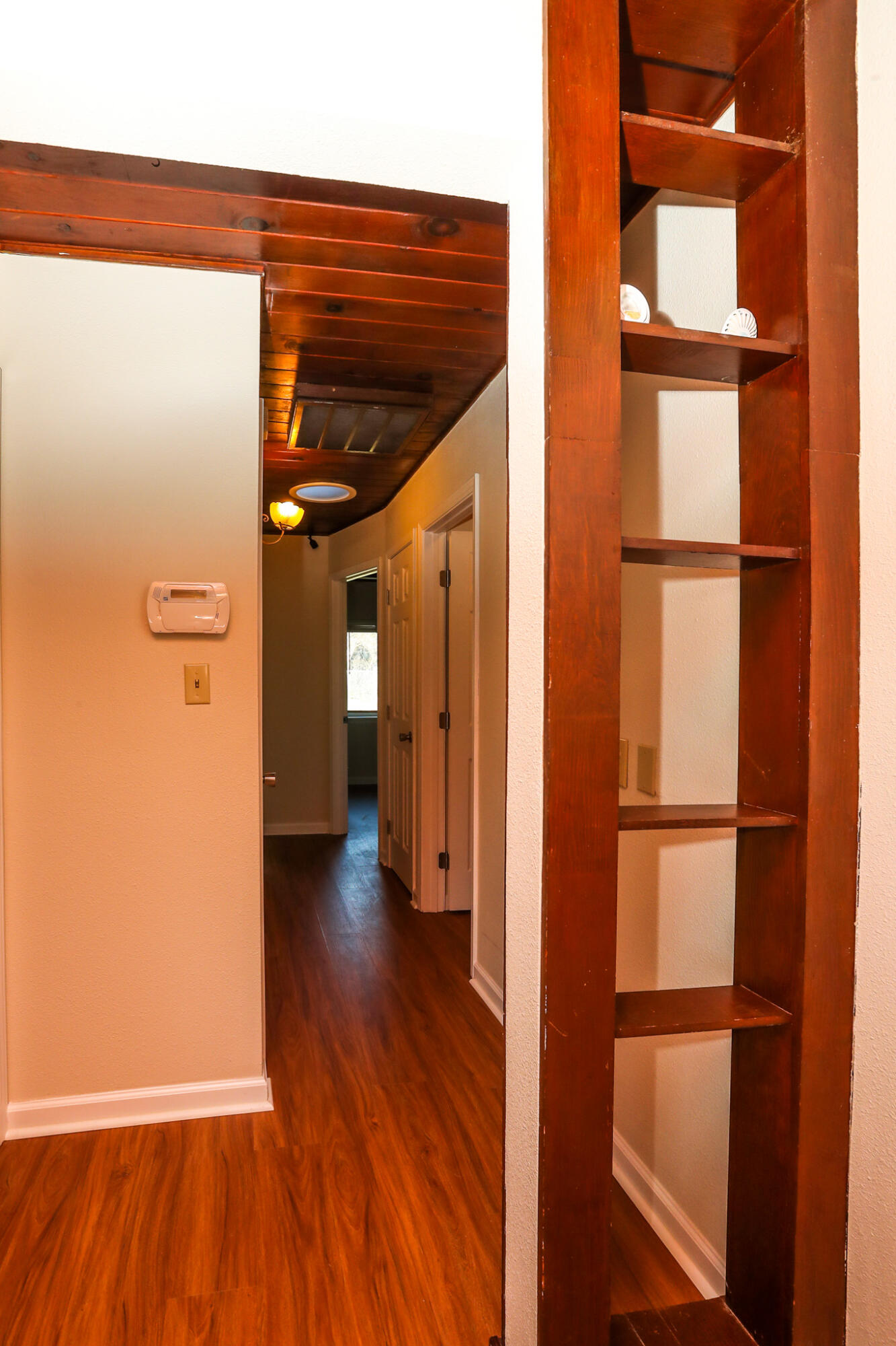 2867 Pinto Lane Anderson, CA 96007 - Photo 20 of 35 a view of a hallway with wooden floor and entryway