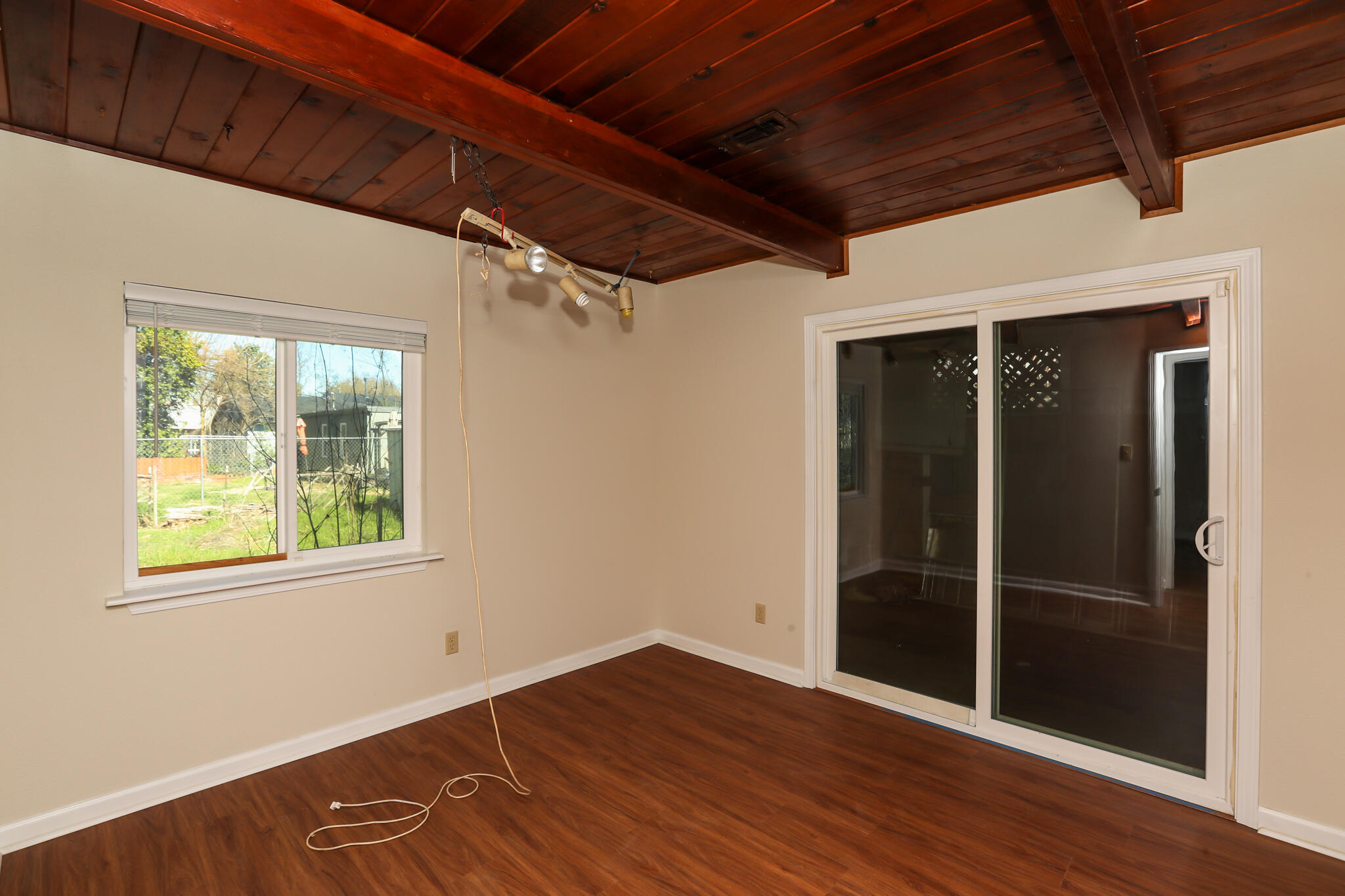 2867 Pinto Lane Anderson, CA 96007 - Photo 24 of 35 a view of an empty room with wooden floor and a window