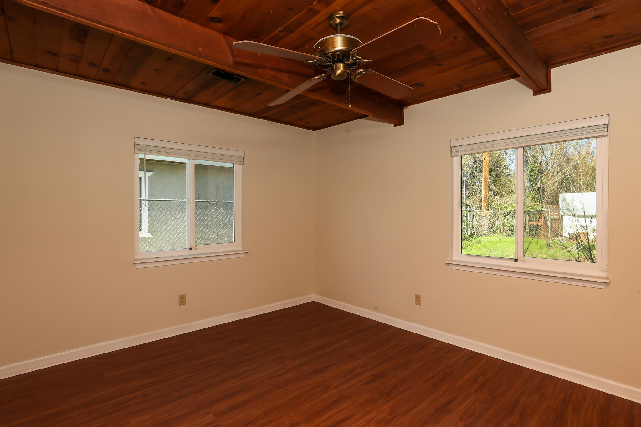 2867 Pinto Lane Anderson, CA 96007 - Photo 26 of 35 a view of an empty room with wooden floor and a window
