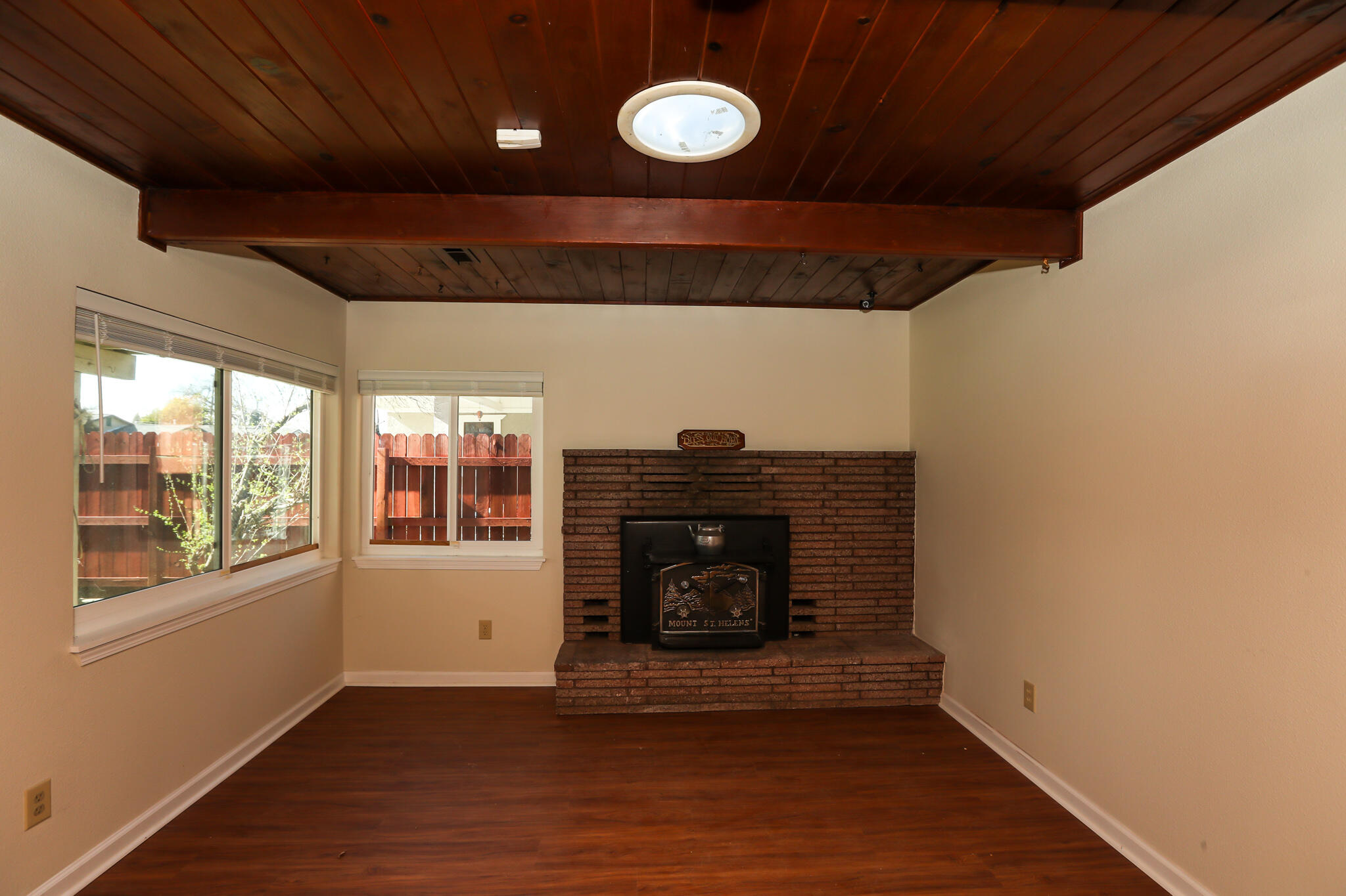 2867 Pinto Lane Anderson, CA 96007 - Photo 9 of 35 a view of an empty room with wooden floor and a window