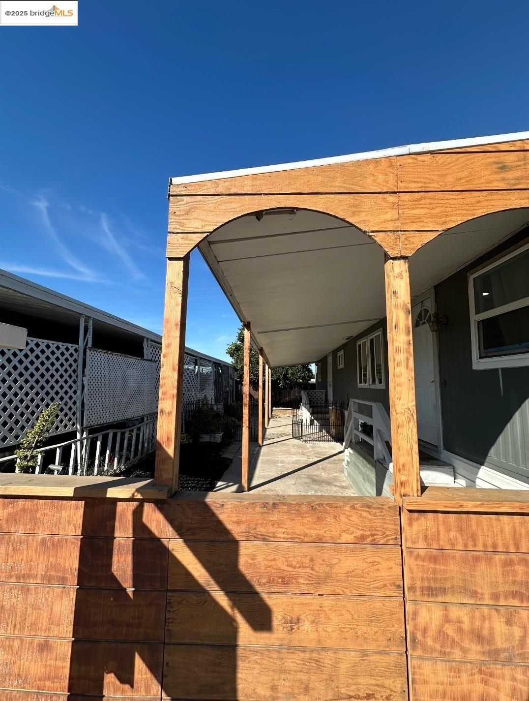 4400 Gateway Road, Unit 38 Bethel Island, CA 94511 - Photo 2 of 10 a view of a patio with a table and chairs under an umbrella
