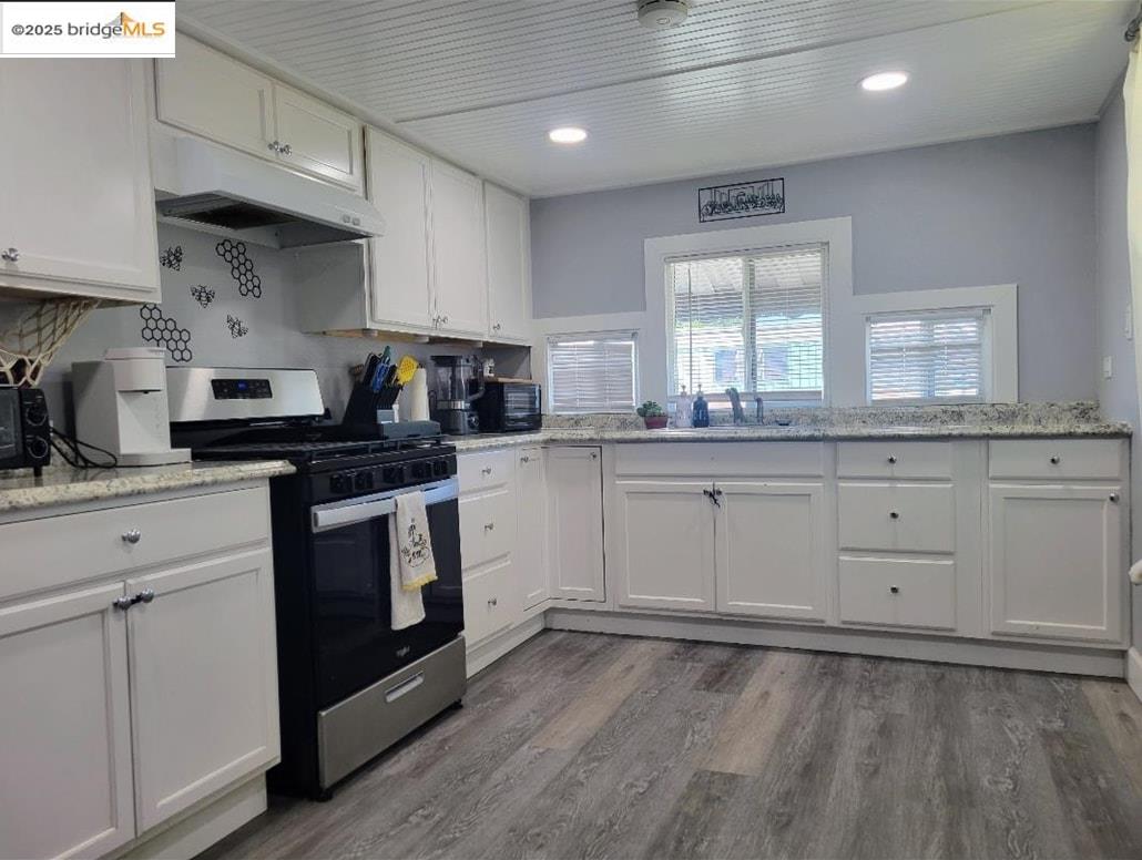 4400 Gateway Road, Unit 38 Bethel Island, CA 94511 - Photo 4 of 10 a kitchen with granite countertop white cabinets and white appliances