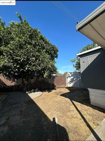 a view of a backyard of the house