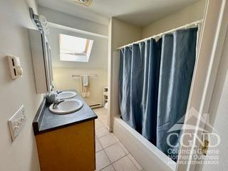 274 Route 65 Route, Unit 41 Hensonville, NY 12439 - Photo 22 of 28 a bathroom with a sink a mirror and a shower