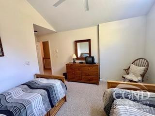 274 Route 65 Route, Unit 41 Hensonville, NY 12439 - Photo 25 of 28 a bedroom with a bed and wooden floor