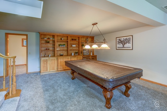 16021 Plank Road Sycamore, IL 60178 - Photo 22 of 35 a living room with furniture pool table and window