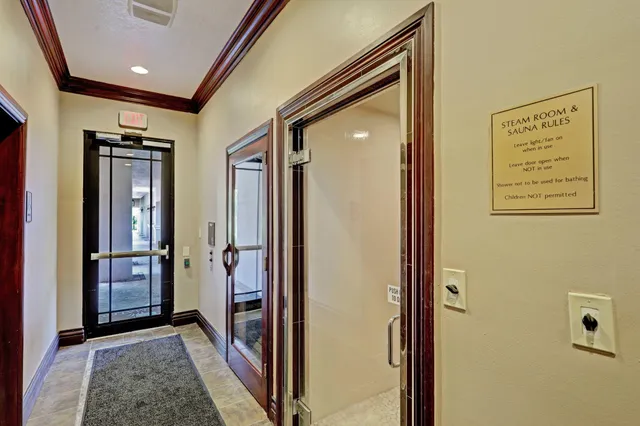 a view of hallway with a hallway and a closet