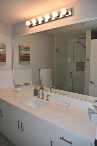 a bathroom with a sink and a mirror