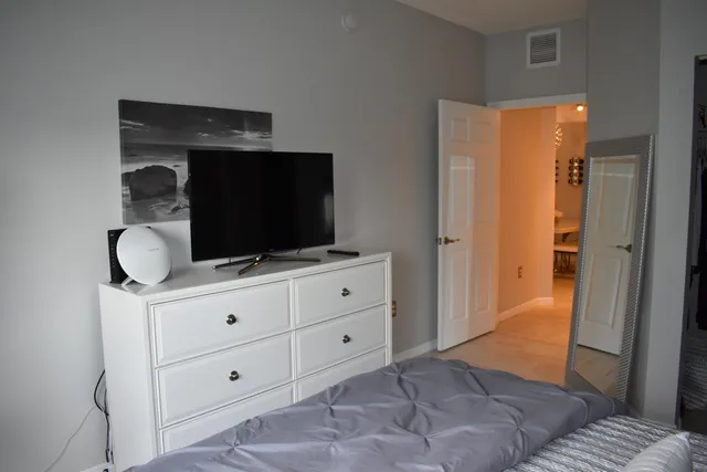 a living room with furniture and flat screen tv