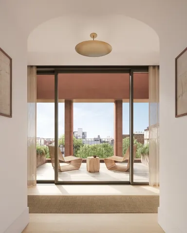 a view of a living room hardwood floor and a large window