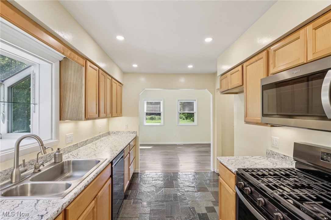 5097 Chillicothe Road Chagrin Falls, OH 44022 - Photo 14 of 45 Kitchen with appliances with stainless steel finishes, recessed lighting, light brown cabinetry, and light countertops