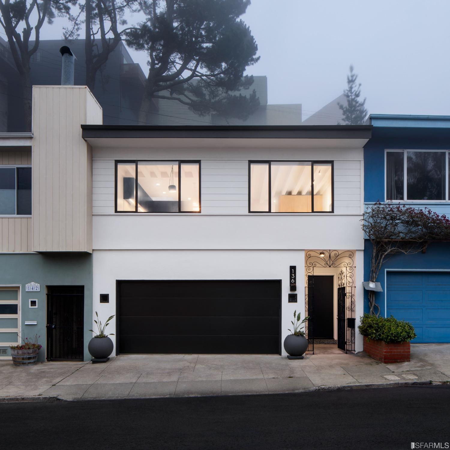 a front view of a house with yard