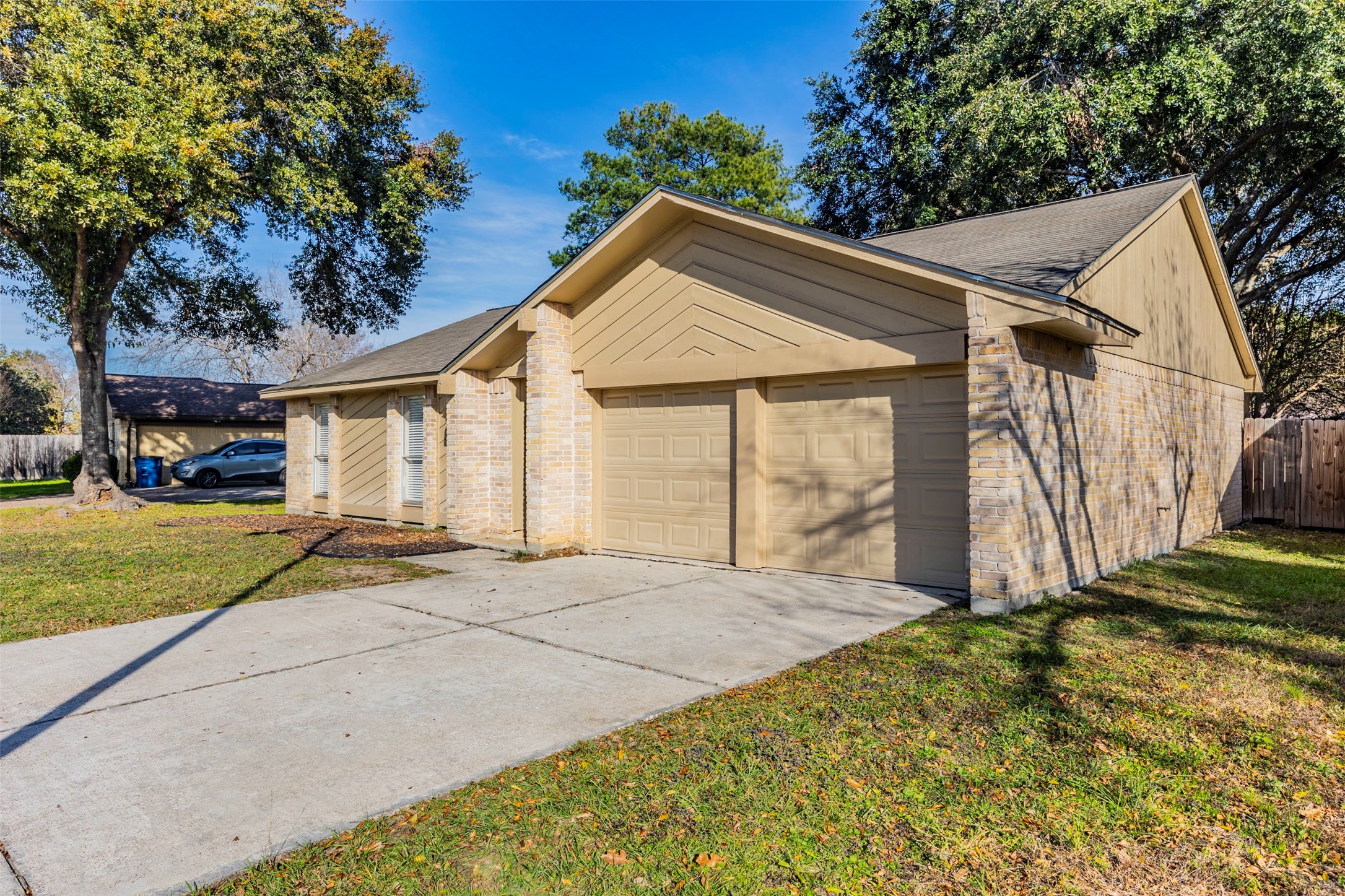 21022 Waymare Lane Spring, TX 77388 - Photo 26 of 29 a view of a house with a small yard and large tree