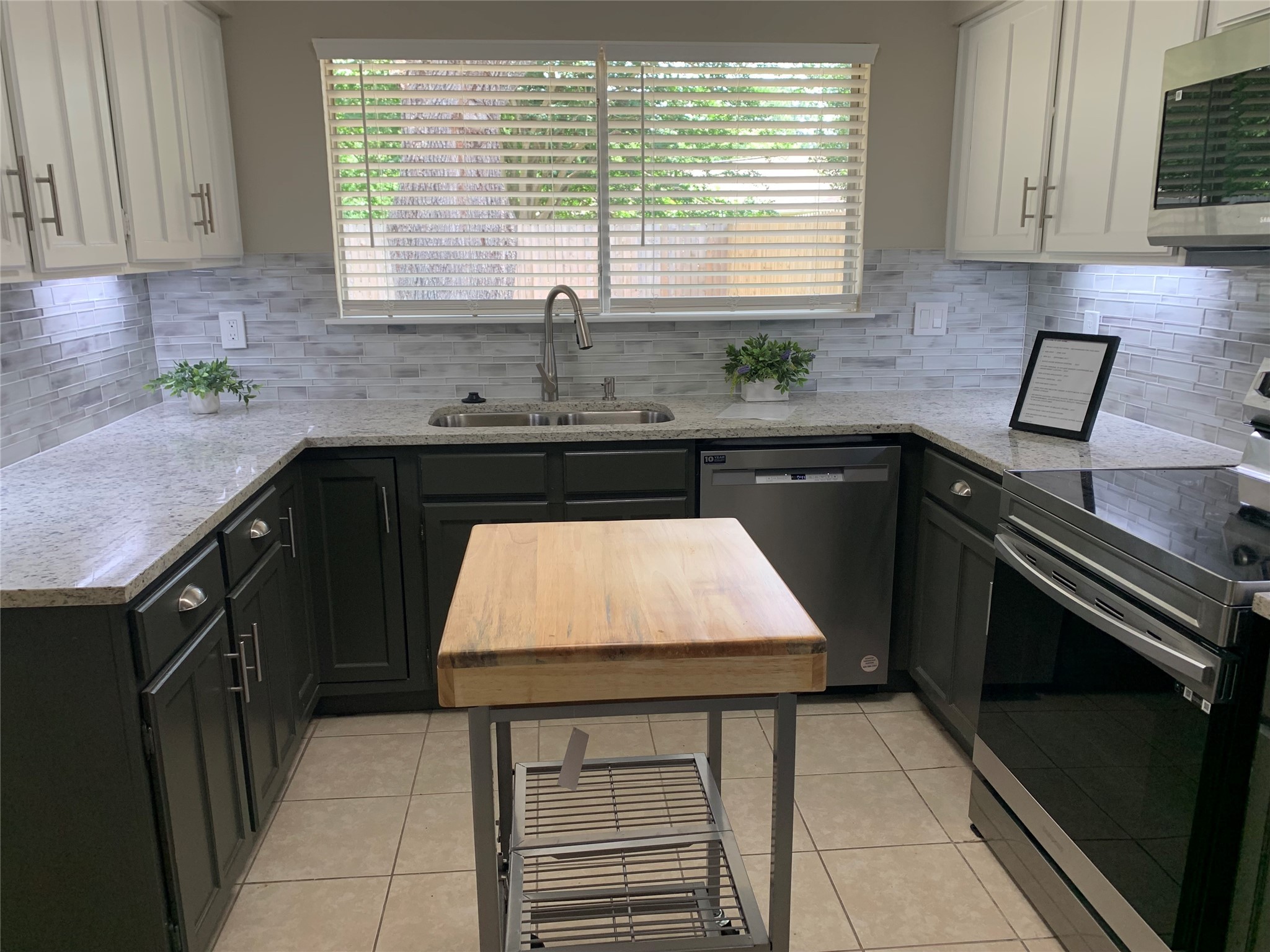 21022 Waymare Lane Spring, TX 77388 - Photo 7 of 29 a kitchen with a sink a stove and cabinets